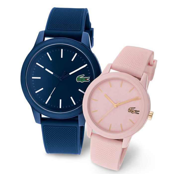 Two watches are shown side by side, one blue and the other pink.