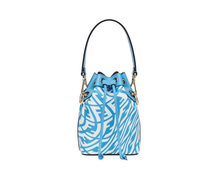 A blue and white bag with a gold chain.