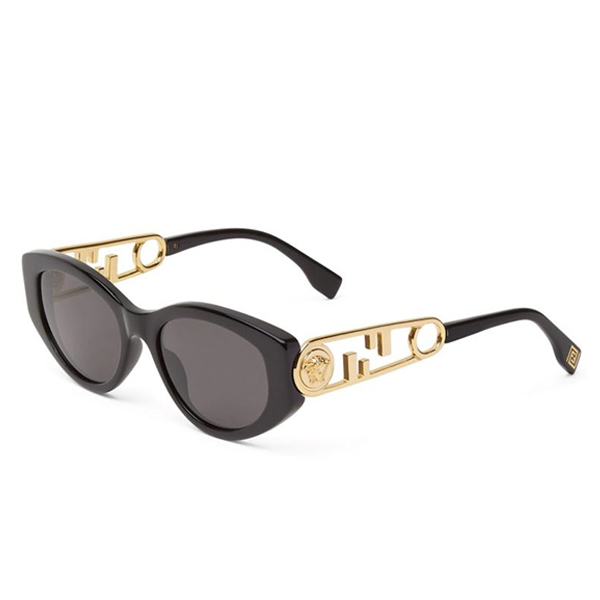 A pair of sunglasses with gold frames and black lenses.