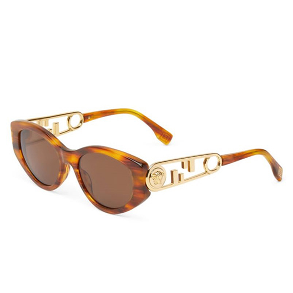 A pair of sunglasses with gold frames and brown lenses.