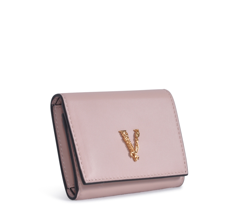 A pink wallet with a v on it.