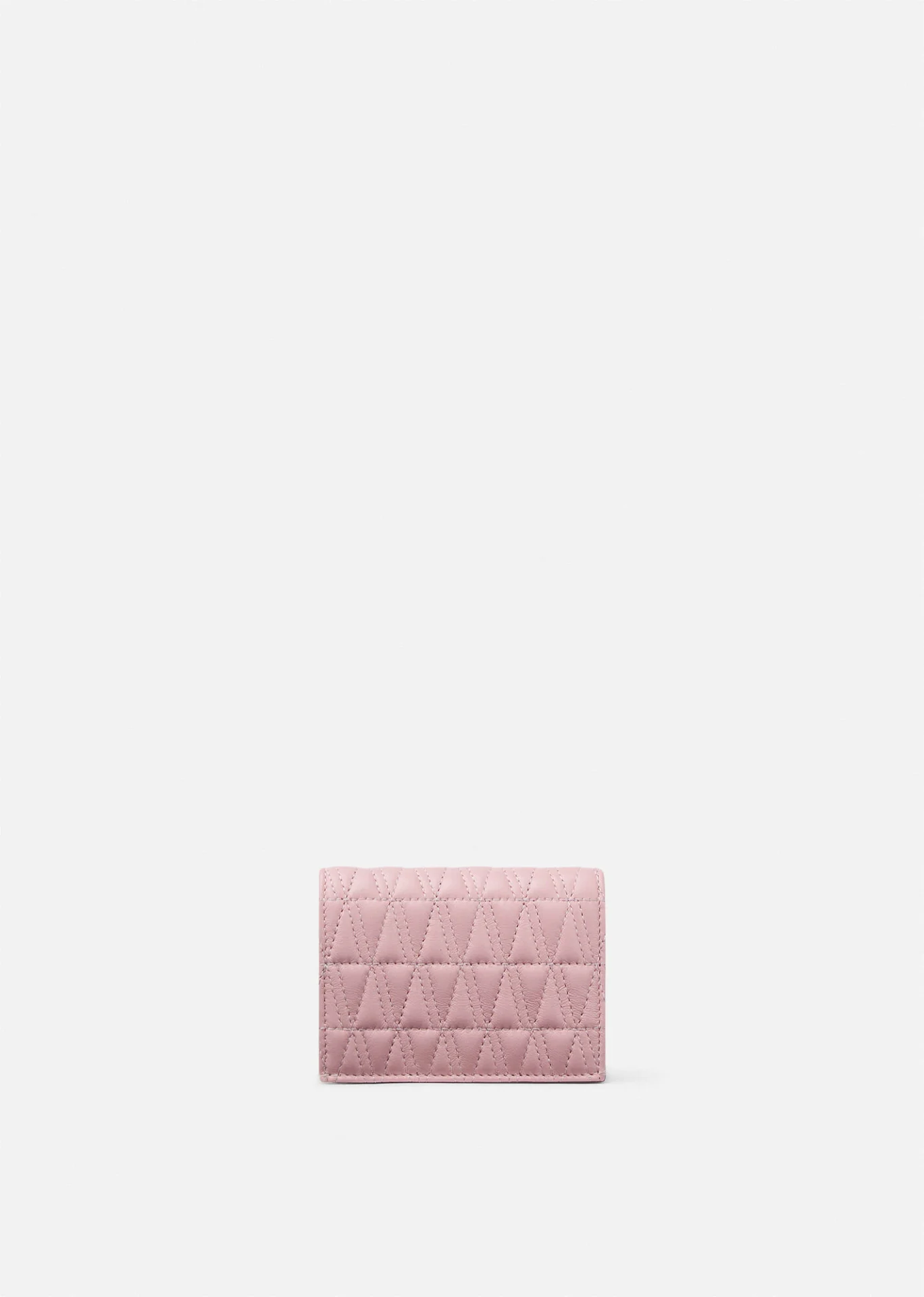 A pink wallet is shown on the side of the wall.