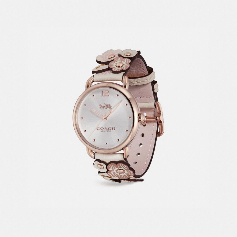 A watch with flowers on it is shown.