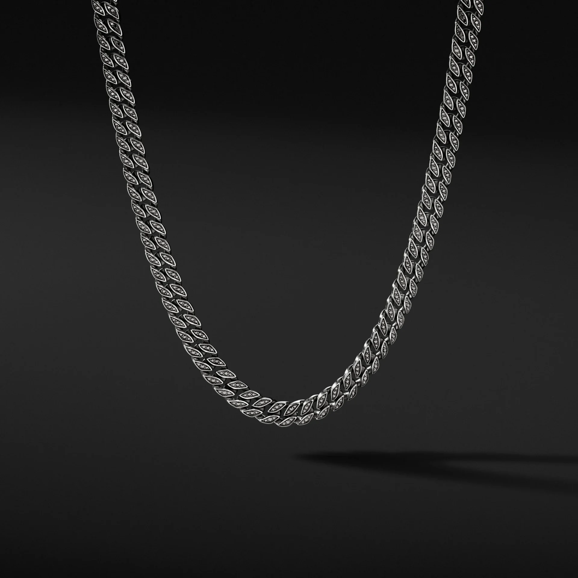 A silver chain is shown on the ground.