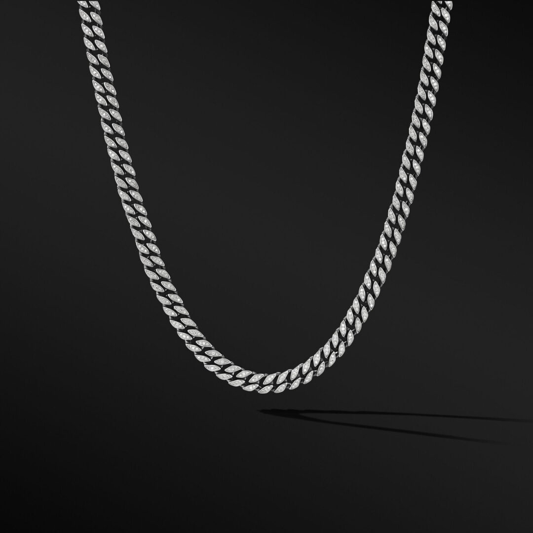 A silver chain is shown on the ground.