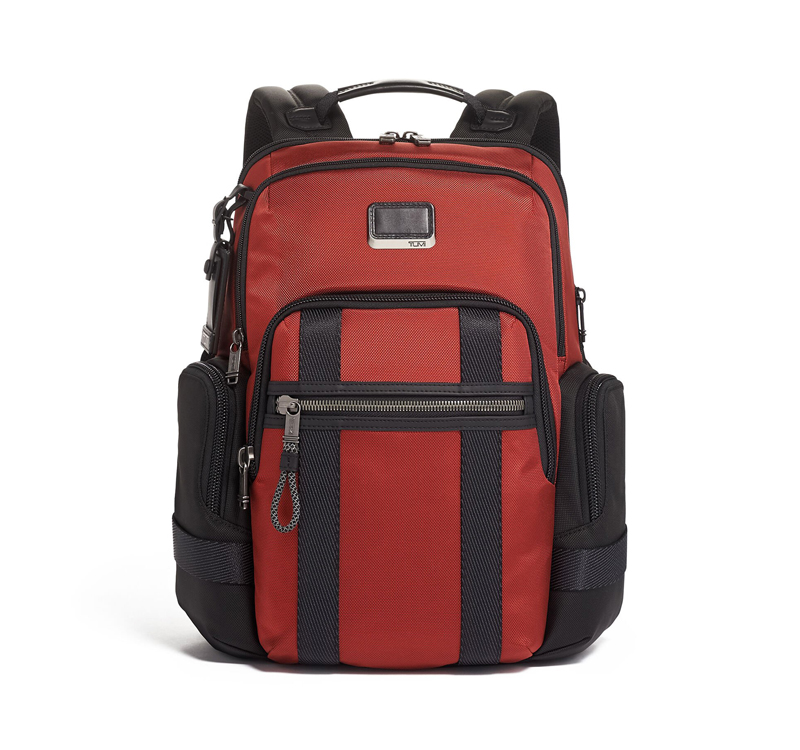 A red backpack with black trim and side pockets.