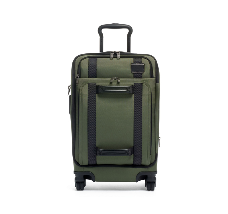 A green suitcase is shown with black trim.