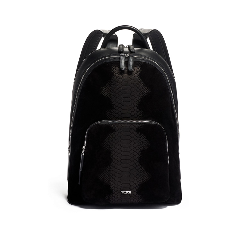 A black backpack with a snake print on it.