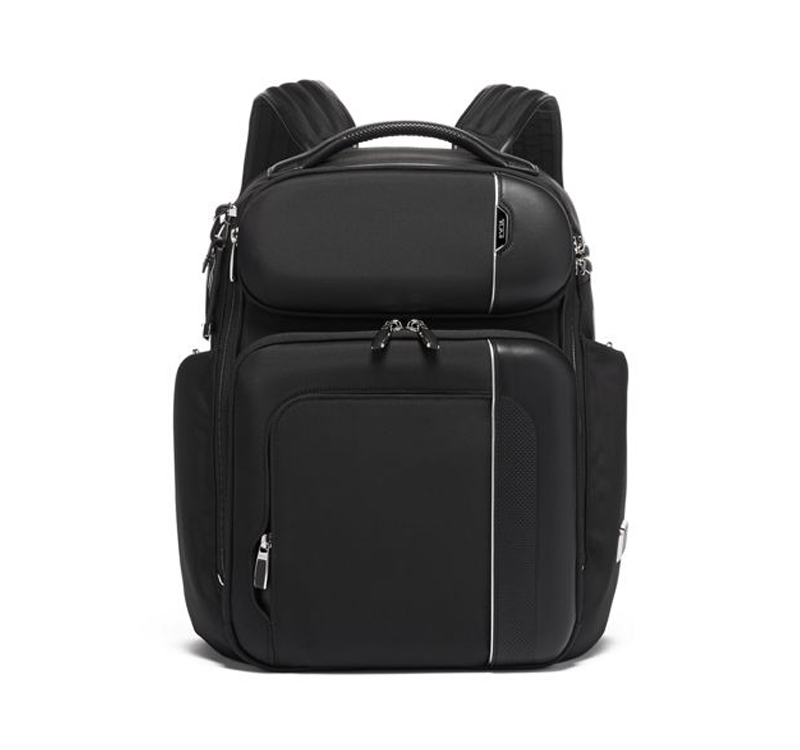 A black backpack with silver accents on it.