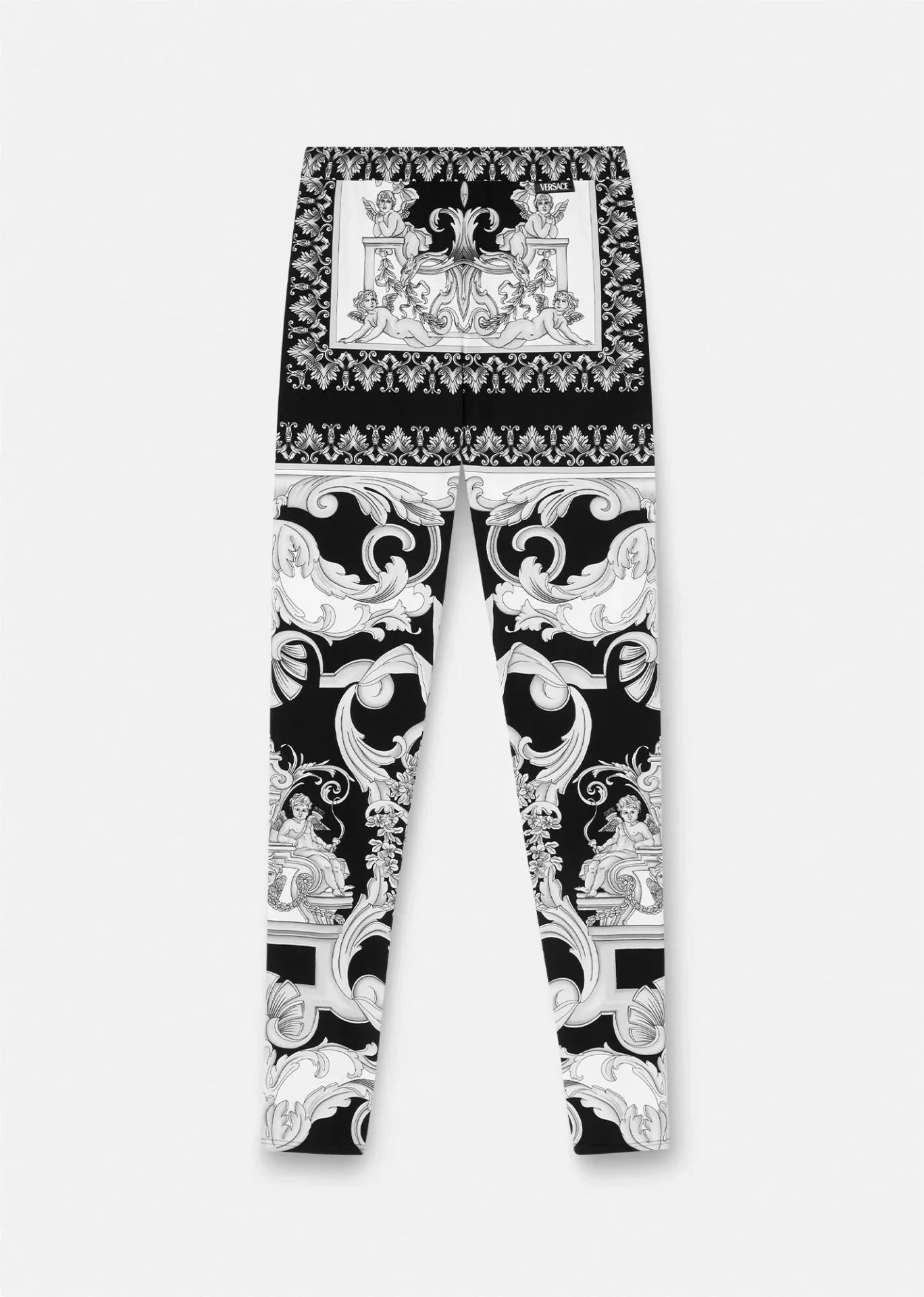 A pair of black and white leggings with an ornate design.