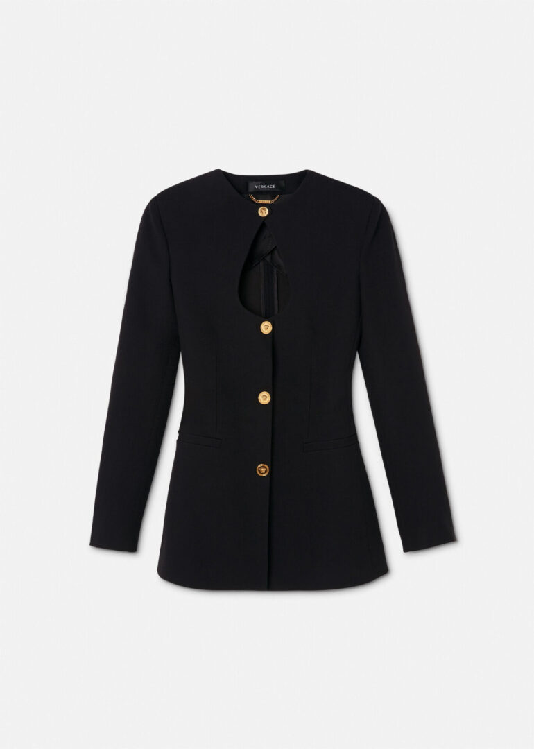 A black jacket with gold buttons and a bow.