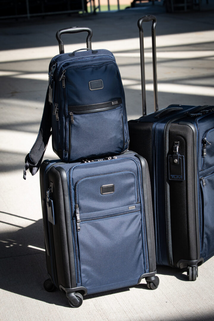 A group of suitcases sitting on top of each other.